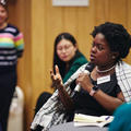 A conference attendee asking a question to a panel speaker