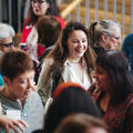 A group of people networking during a conference break