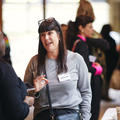 A woman networking at a conference