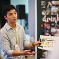 A startup founder talking to event attendees at their stand