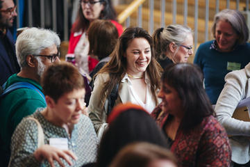 A group of people networking during a conference break