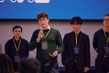 An early stage entrepreneur pitching to an audience