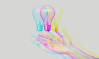 A hand outstretched with a lightbulb hovering over it with a trippy design