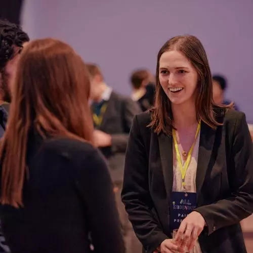 Attendees networking at a startup event