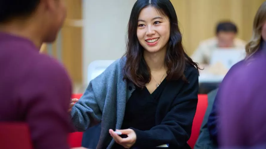STUDENTS SITTING IN THE STEPHEN A. SCHWARZMAN CENTRE FOR THE HUMANITIES'S GREAT HALL