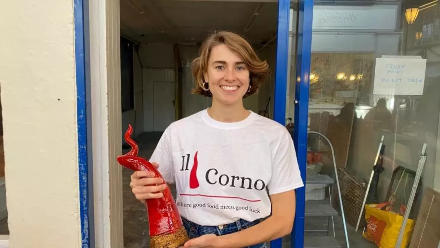 Owner of Il Corno, Fanny Clemente, standing in the new restaurant doorway