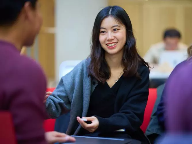 STUDENTS SITTING IN THE STEPHEN A. SCHWARZMAN CENTRE FOR THE HUMANITIES'S GREAT HALL