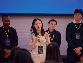 A student pitching at a startup competition event