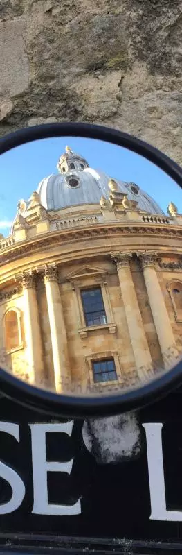 RADCLIFFE CAMERA REFLECTED IN A MIRROR ON BRASENOSE LANE