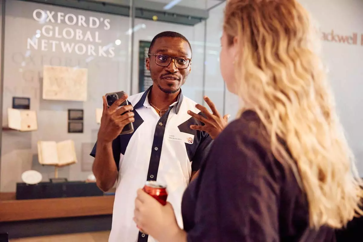 A man and women talking animatedly at an event