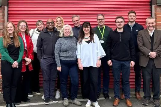 The OUI Social Ventures team standing for a group shot