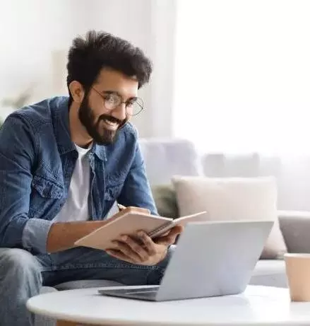 Man on sofa with laptop